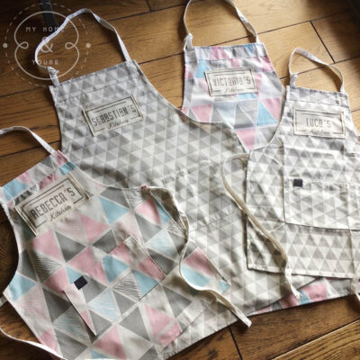 kitchen-aprons-with-the-names-of-every-family-member-hand-printed-on-a-modern-apron
